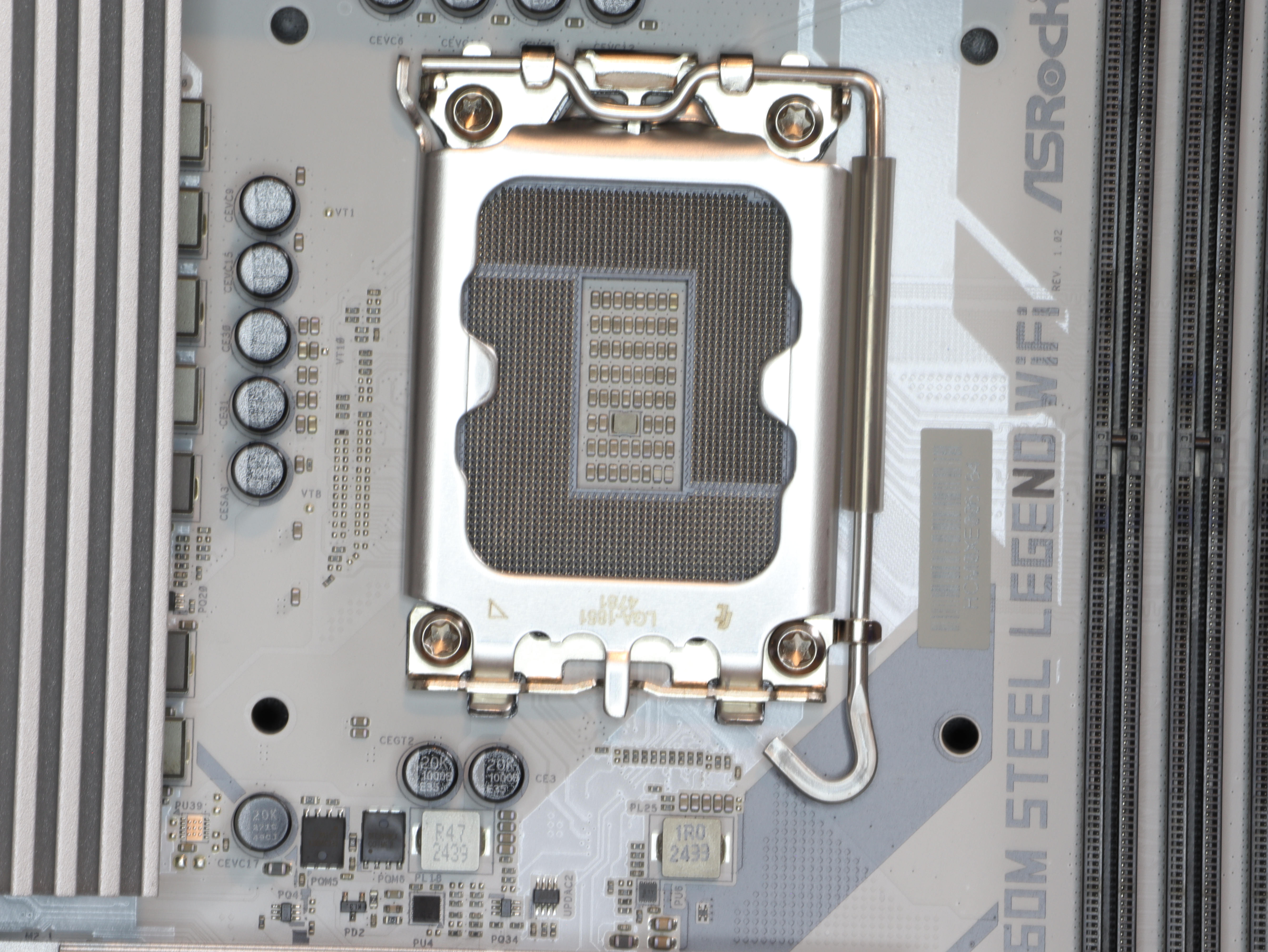 ASRock B860M Steel Legend WiFi motherboard heatsinks VRM cooling design closeup.JPG